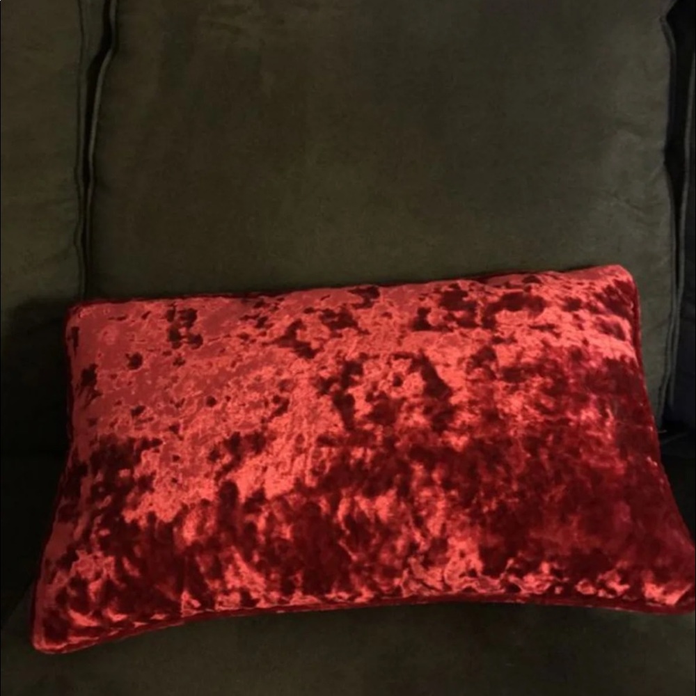 Red velvet throw pillow. Size is approx 18”L x 10”H.